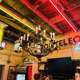 a chandelier and neon signs