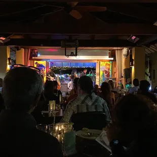 people sitting at tables in a restaurant