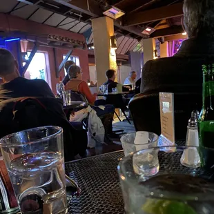 people sitting at tables in a restaurant