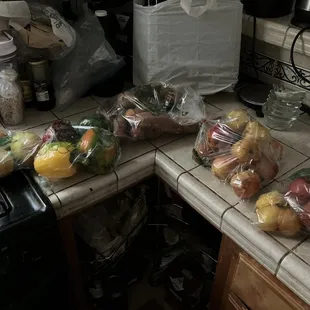 Bags of mangoes, peppers, tomatoes, sweet potatoes, and pears -- all from the discount shelf, and all for a total of $10.13.