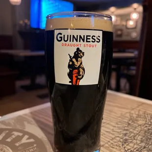 a pint of guinness on a table