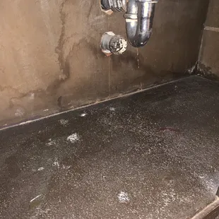 Disgusting, water damaged bathroom sink.