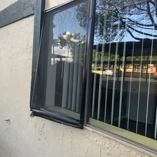 Window screen was like this when I moved in. It's just taped on but the tapes only sticking to half the window.