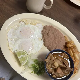 a plate of mexican food and a cup of coffee