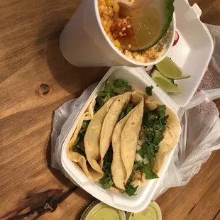 a bowl of soup and a plate of tacos