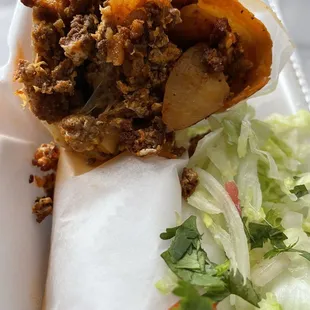 This is a Chorizo, Eggs, potato, cheese, and salsa Burrito! Yum, soooo delicious!!! You need to try one!