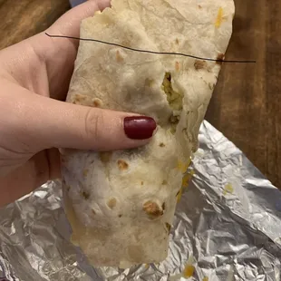 The burrito was folded horrible with a rip  in it and the eggs didn't start till the line I drew.