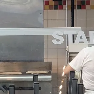 Cooking tortillas in the front