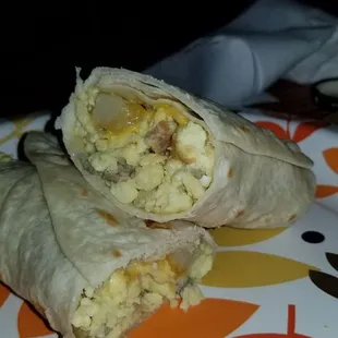 a breakfast burrito on a plate