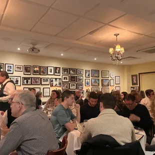 a large group of people sitting at tables