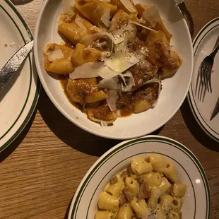 a plate of pasta with meat and cheese