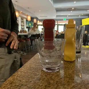 a glass of water and a salt shaker