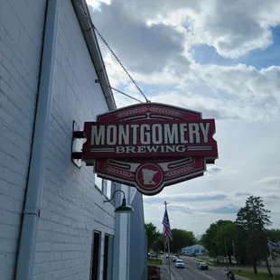 a brick building with a sign that reads montgomery brewing