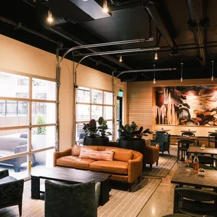 a large living room with leather furniture