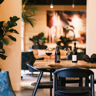 a table with two bottles of wine