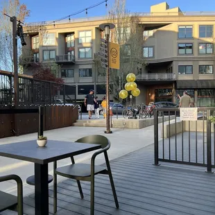 a patio with a table and chairs