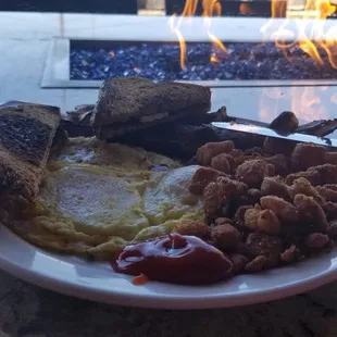 Breakfast straight up; eggs potato  Bacon toast. Cheers