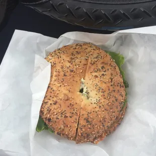 Bagel san which with bacon a lol more toasted than I like but looks good