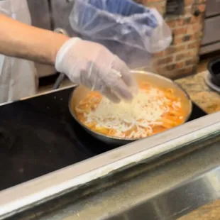 a person in a kitchen preparing food