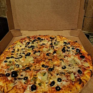 Large veggie pizza with sauce added.