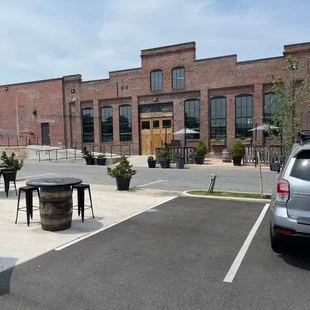 a parking lot with tables and chairs