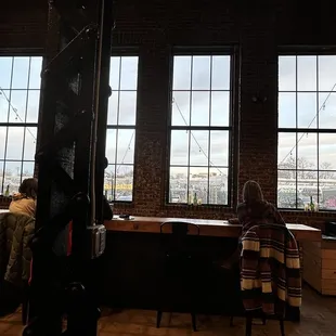 two people sitting at a bar