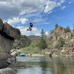 Jumping in the river.