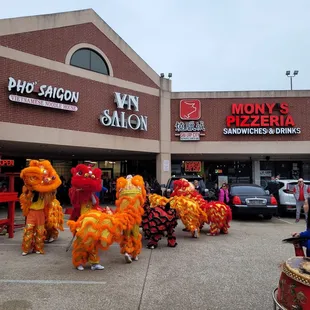 a group of people dressed in lion costumes