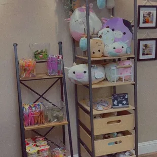 a shelf of stuffed animals