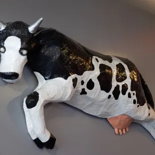 a cow mounted on a wall