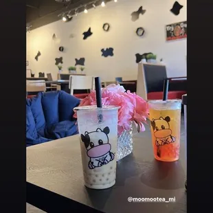 a coffee cup with a pink flower in it