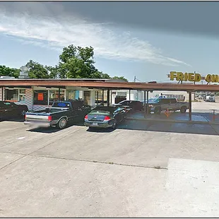 a parking lot with cars parked in it