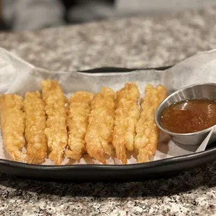a basket of deep fried french fries