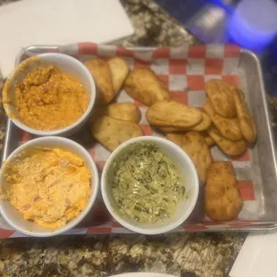 Spinach dip, pimento cheese dip and red pepper hummus with garlic pita chips so dank