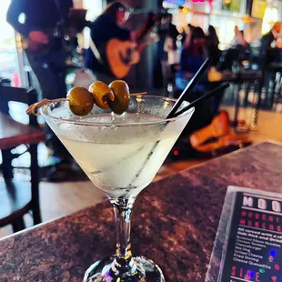 a martini with olives in it
