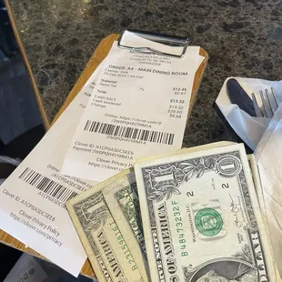 a pile of money on a table