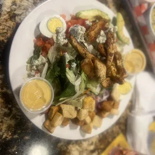 Blackened Chicken salad (added croutons and red onions) with house made honey mustard SO good and big! It was 3 meals for me!