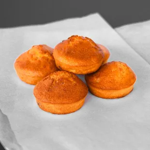 a bunch of muffins on a napkin