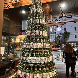 a christmas tree made of beer bottles