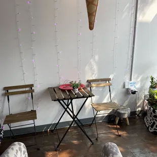 a living room with a table and chairs