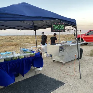 a table with food under a tent