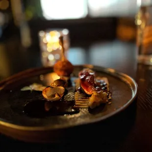 Roast Squab with beluga lentils, cauliflower-almond purée, leg bon-bon, grape gel and natural jus