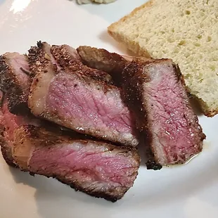 steak, mashed potatoes and bread