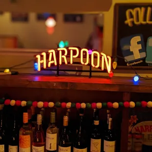a neon sign for harpoon