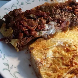 Full Monty - Steak, bacon, provolone, BBQ sauce (added fried onions, fried peppers, and 3 scrambled eggs) - half of a large sub