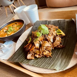  plate of food and a bowl of soup