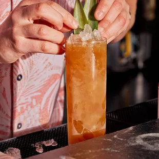 a bartender preparing a cocktail