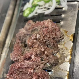 Marinated beef bulgogi. Onions and jalapeños
