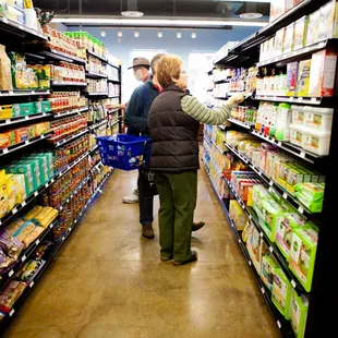 two people shopping in a grocery store