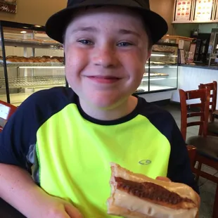 Sam loving the maple- bacon longjohn...... Wow.  Excellent bakery and loves my croissant breakfast sandwich!